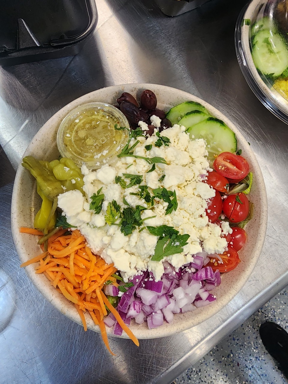 Fresh Greek Salad Bowl at Sunset Grill OKI restaurant in Oak Island, NC