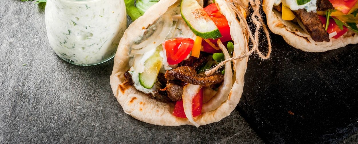 Mediterranean gyro with fresh vegetables and tzatziki sauce at Sunset Grill OKI in Oak Island, NC